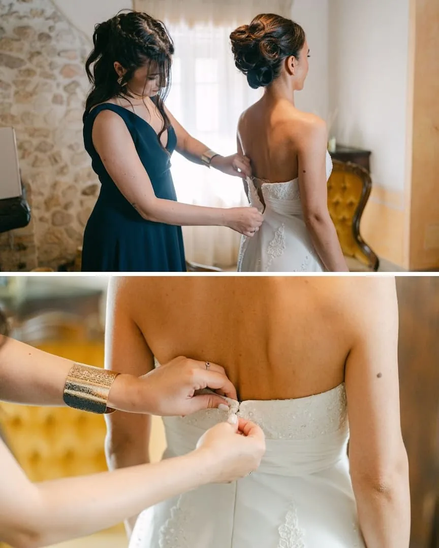 Bride getting ready as her bridesmaid laces up the dress before the ceremony, Italian wedding
