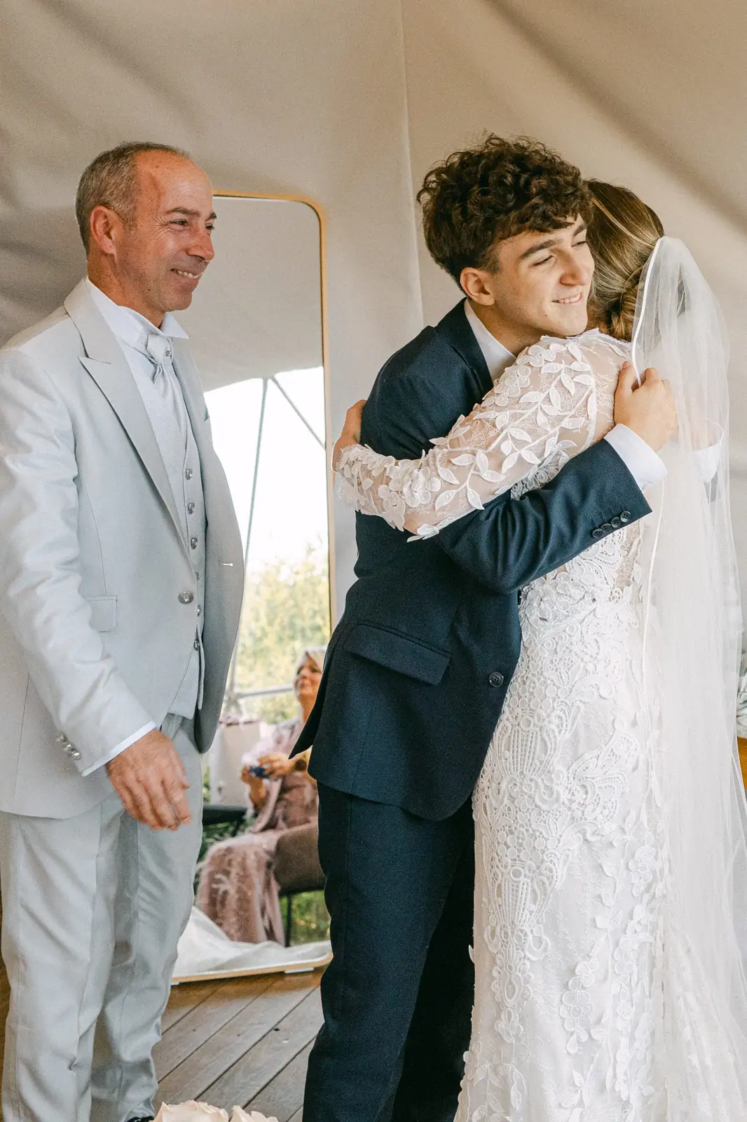 The bride embracing a family member during the getting ready