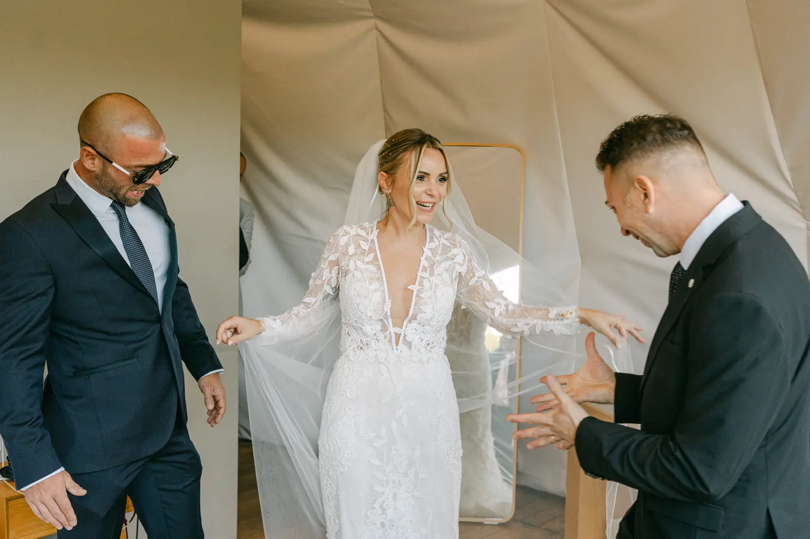 The bride greeting guests during the getting ready
