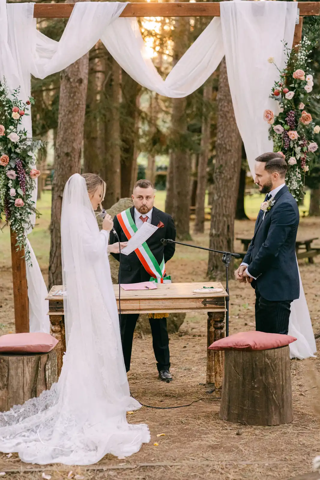 The couple at the altar with the officiant during the civil ceremony