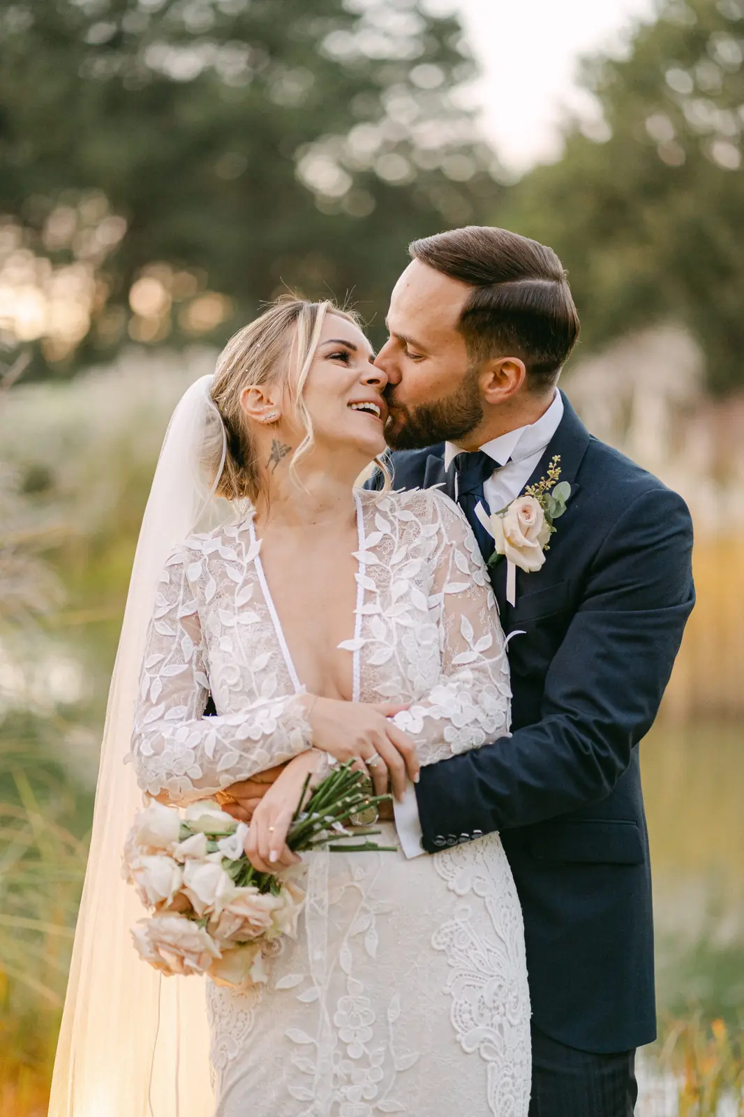 A portrait of the couple laughing during their session