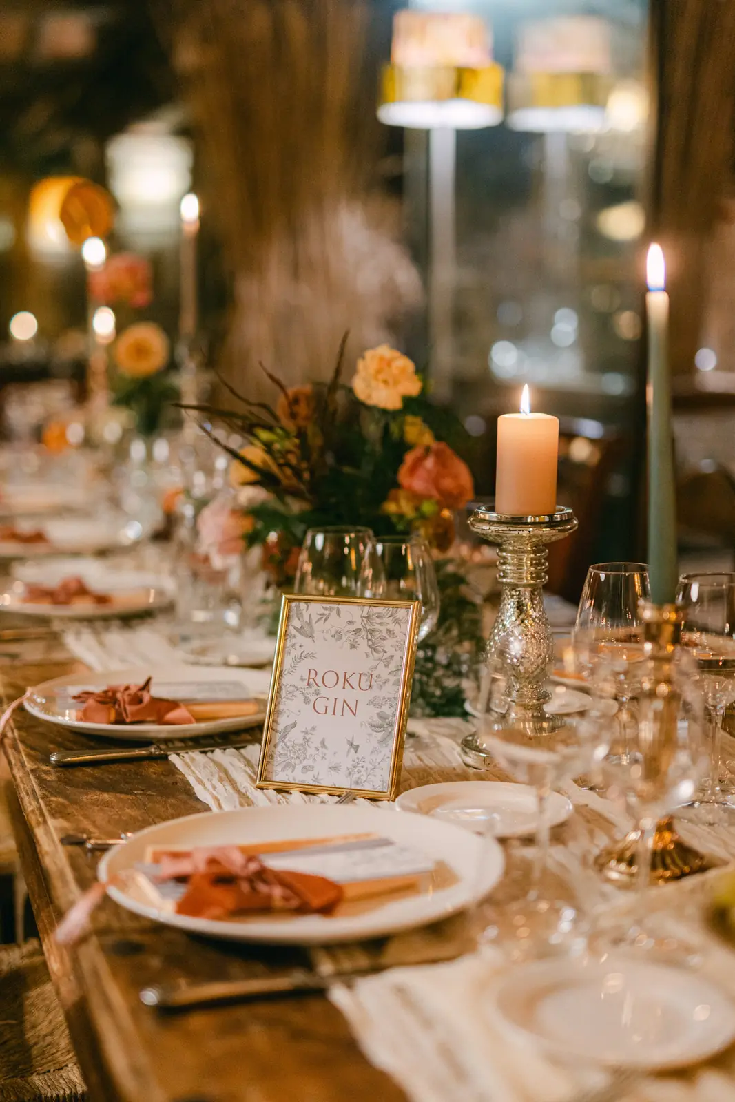 A detail of the autumnal flowers and the place setting