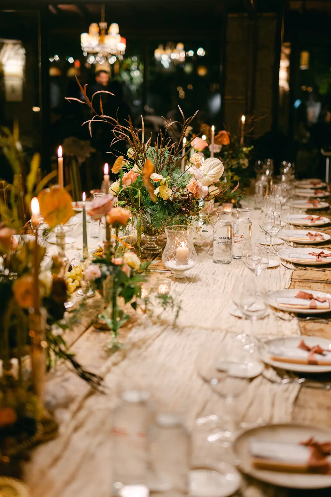 The long reception table lit by candlelight
