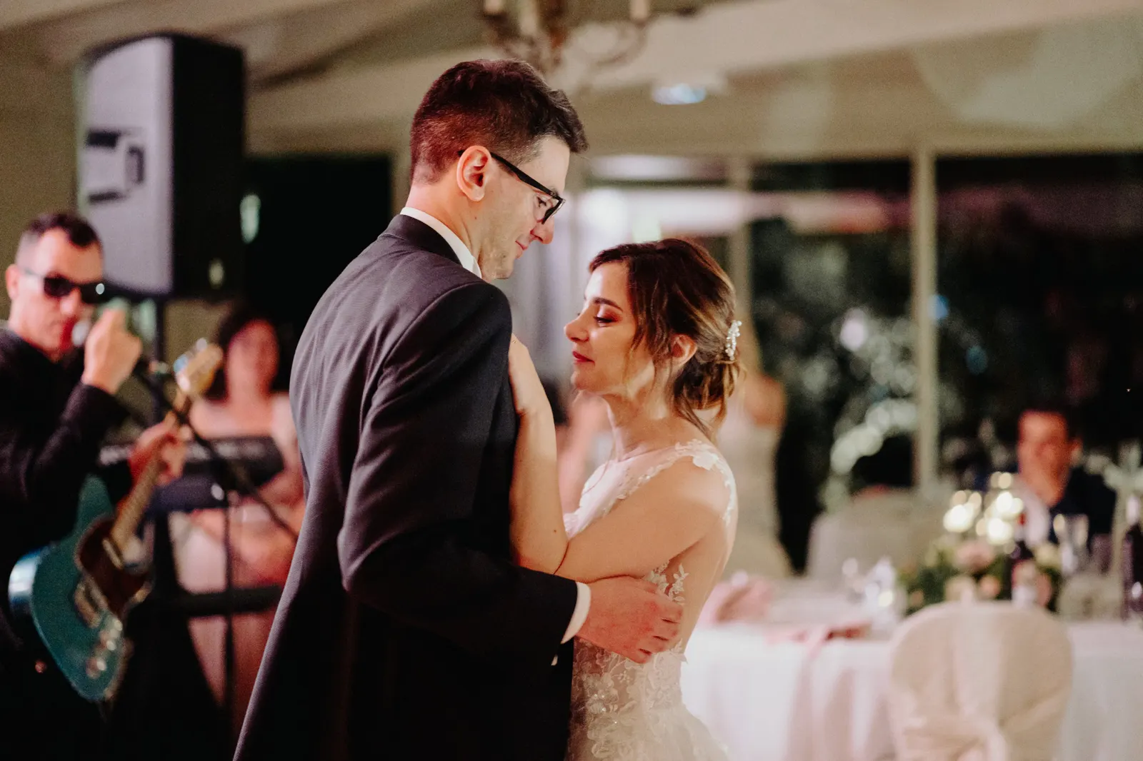 The couple's first dance while the band plays live