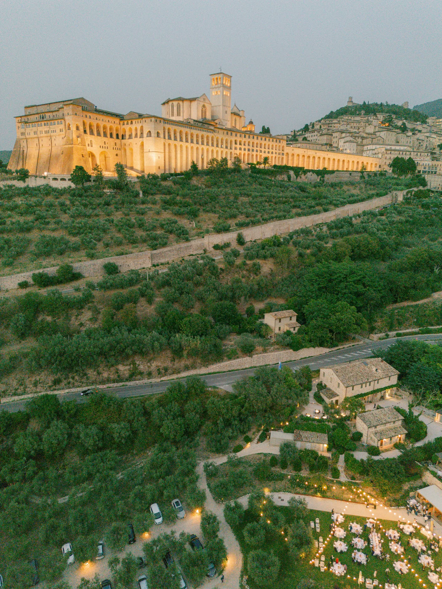 Aerial view of Borgo Antichi Orti below the Basilica of San Francesco, at dusk