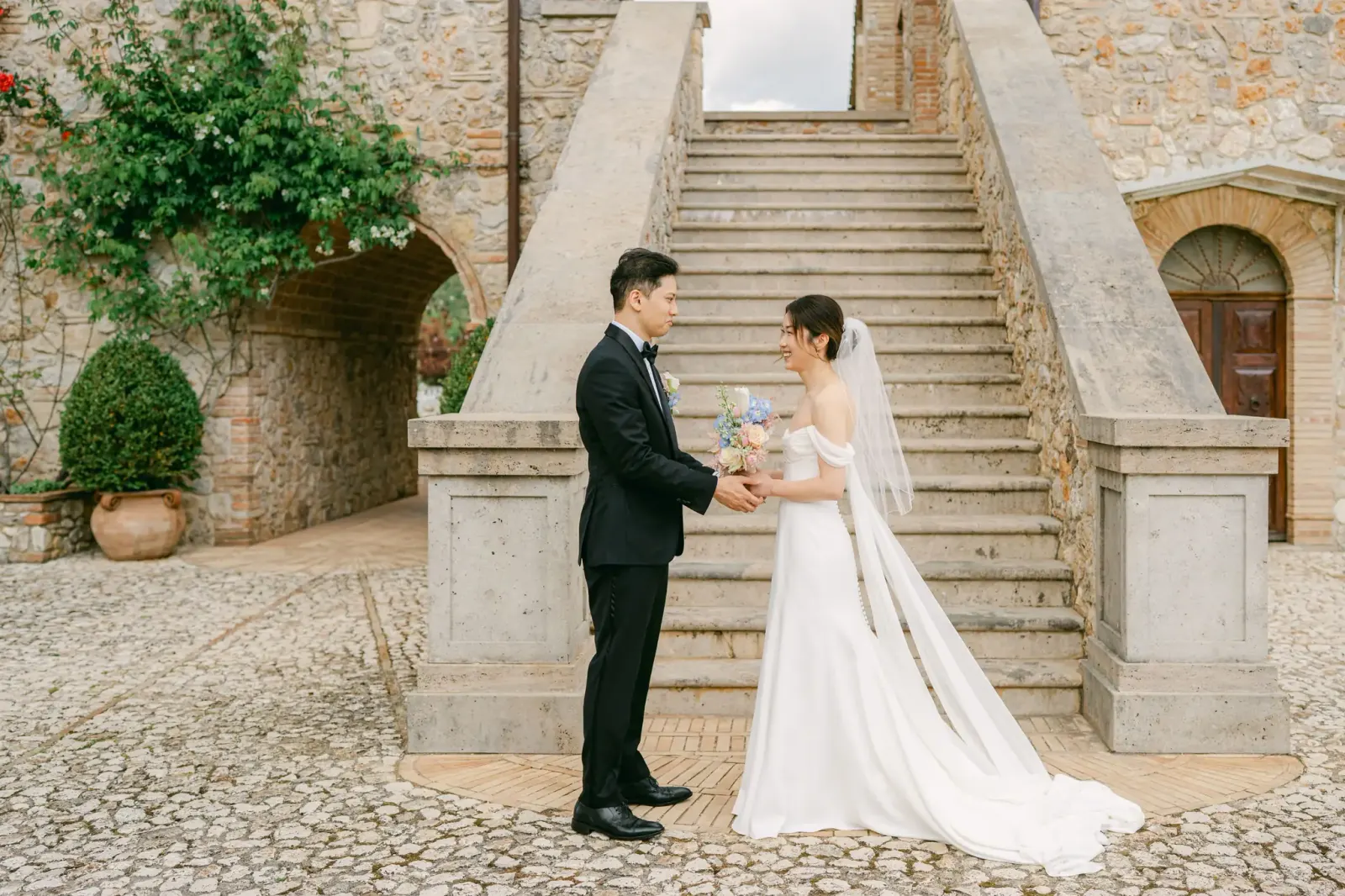 Audrey and James seeing each other for the first time at the foot of the staircase