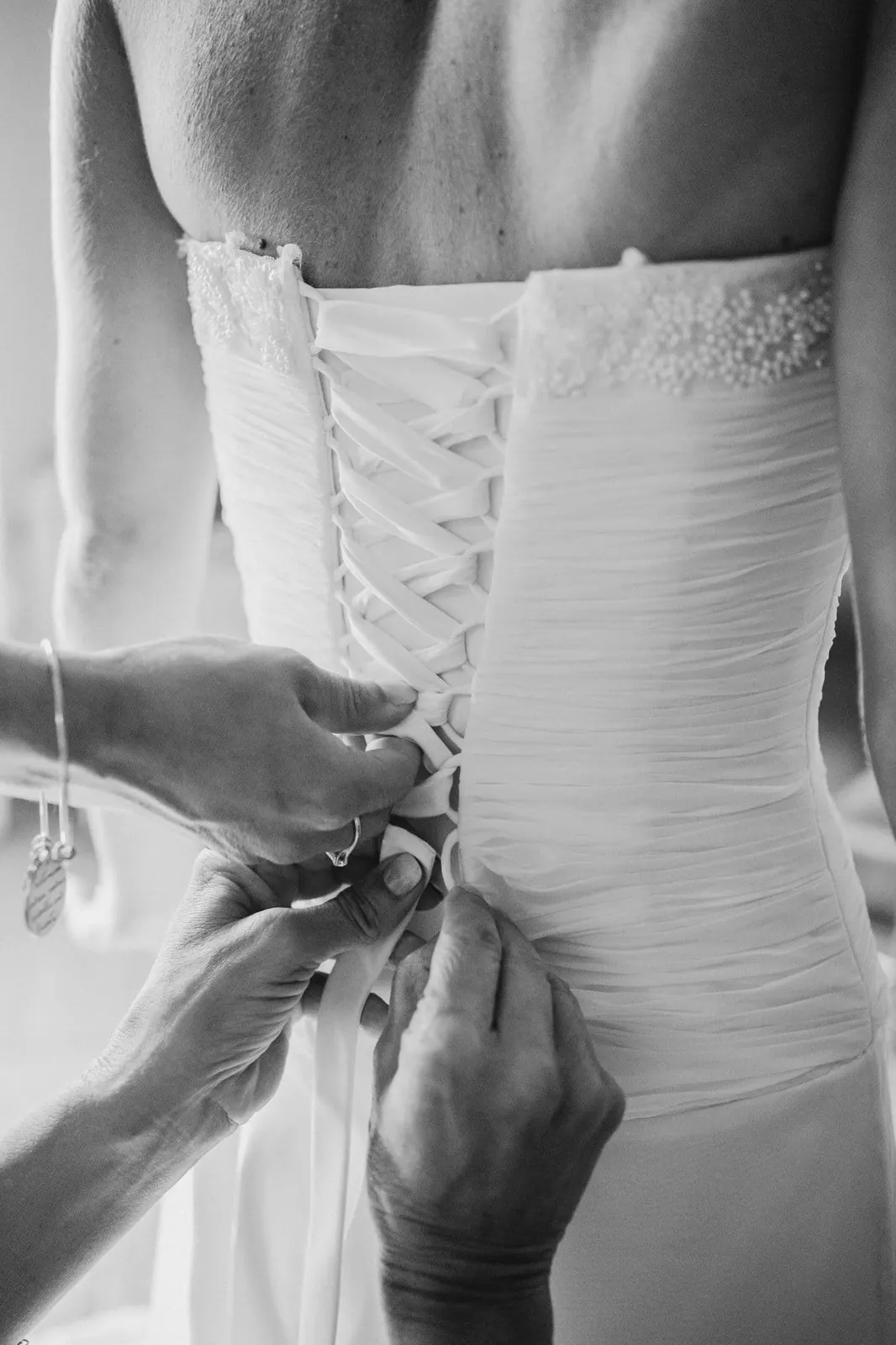 The lacing of the wedding dress corset, in black and white