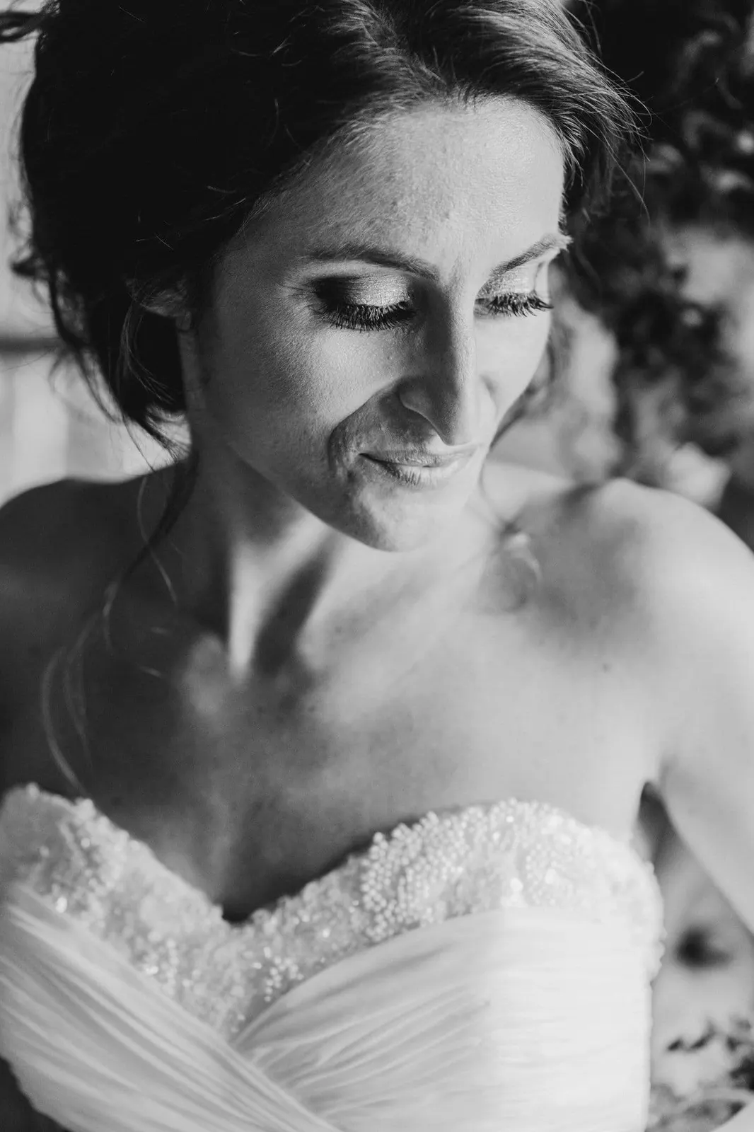 Portrait of Giulia in her sweetheart-neckline dress, in black and white