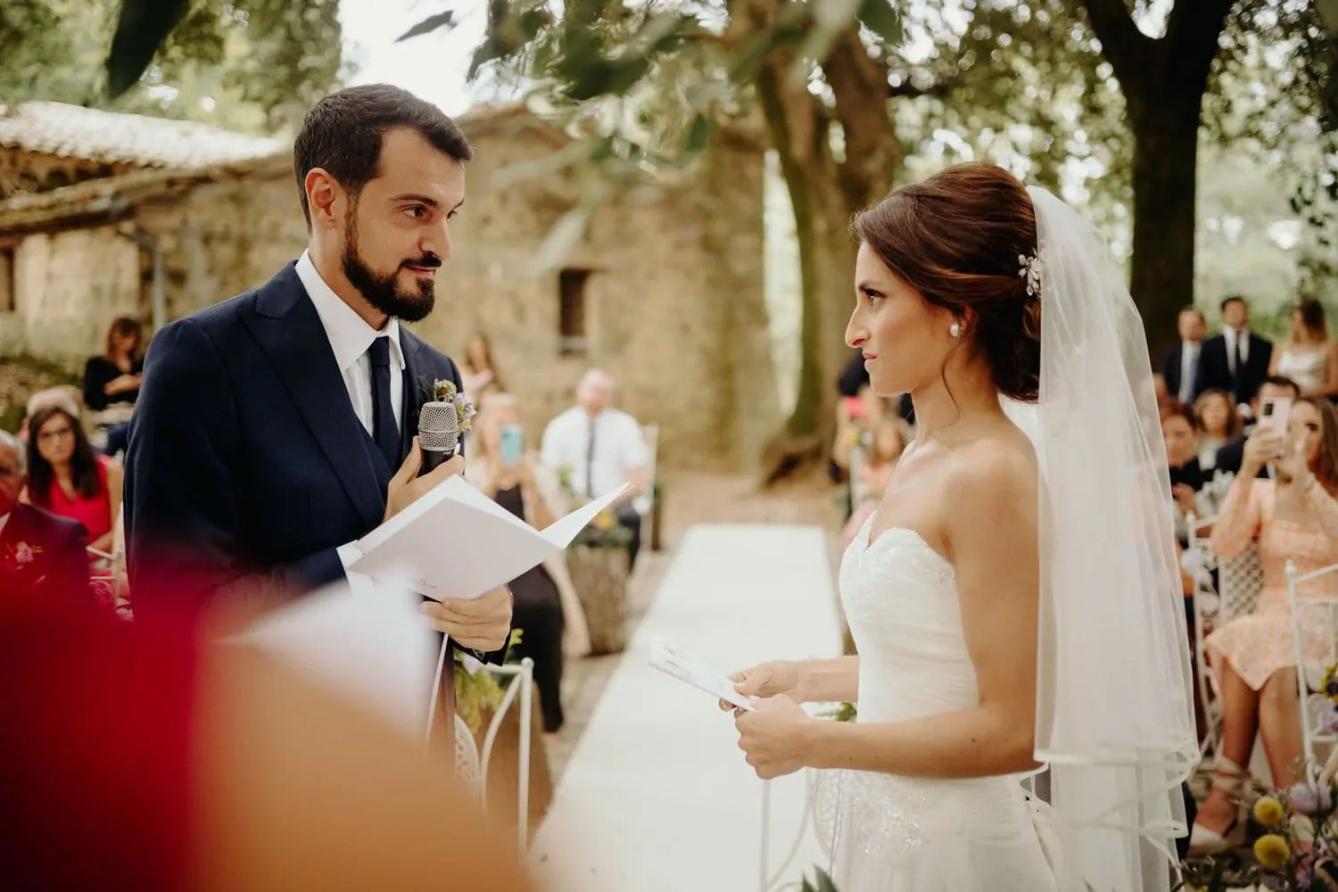 Francesco reading his vows to Giulia at the microphone